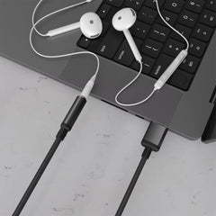 A Photo Of Porodo Audiolink Female 3.5mm Audio Jack to USB-A Adapter | 10cm Cable Length - Black Color | (PDCBL0041BK)