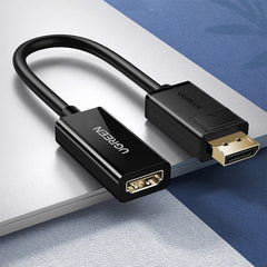 A Photo Of UGREEN DisplayPort to HDMI Adapter Cable (Male to Female) – 4K@30Hz, Unidirectional, 25cm, Black