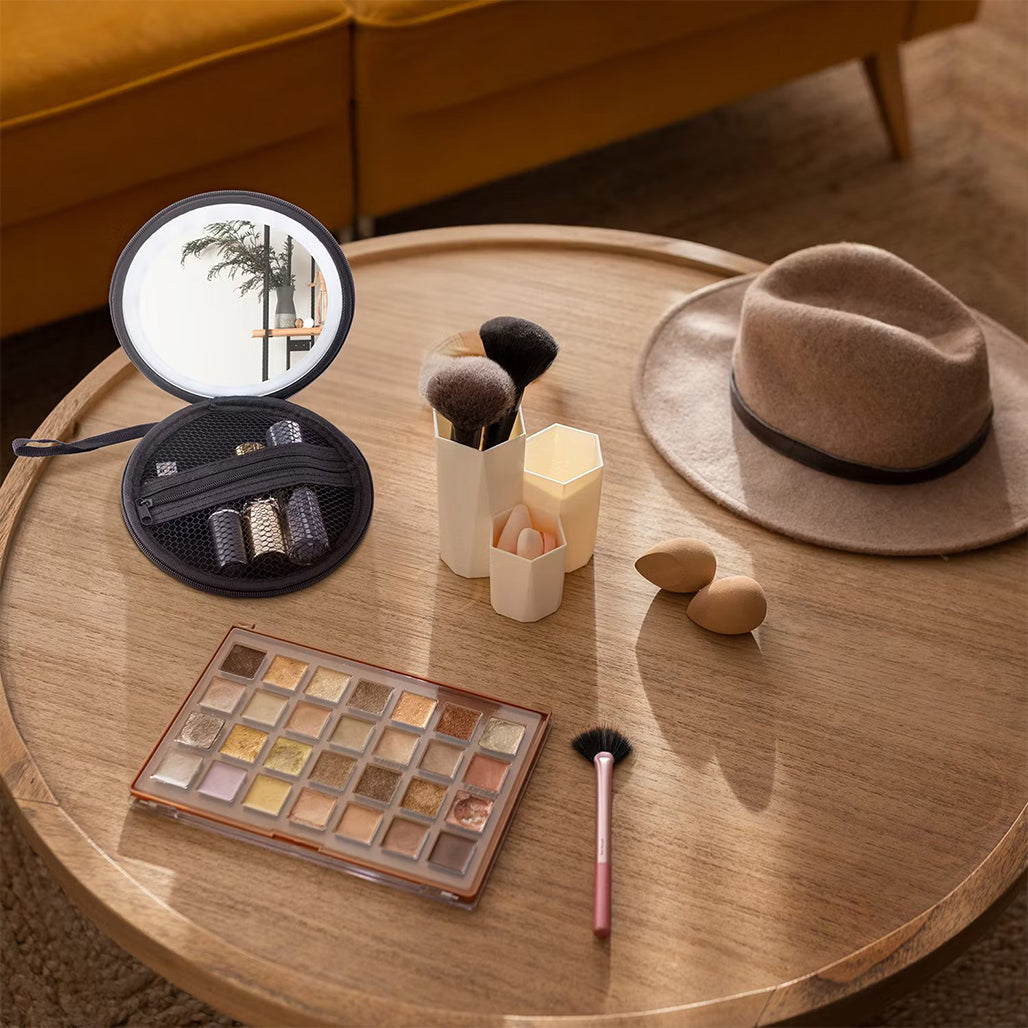 A Photo Of Green Lion Mini Makeup Pouch with LED Mirror, 36 LED Beads, Adjustable Brightness & Built-in Organizer – 800mAh Rechargeable Battery, Black