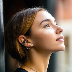 A Photo Of Green Lion Aurix Clip-On Bluetooth Earbuds