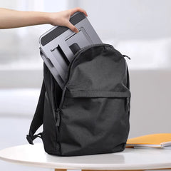 A Photo Of Adjustable Three-Layer Laptop Stand with Folding Storage and Cooling Base – Portable Carbon Steel Vertical Lifting Stand