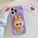 A Small Photo Of Labubu Shockproof Silicone Case with Stand for iPhone 16 Pro's Color Variant