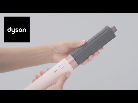 A Video Of Dyson Airwrap Co-anda2x - Multi-Styler and Dryer Straight+Wavy - (Amber Silk Special Edition)